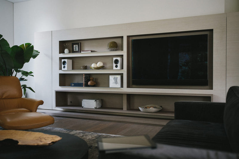 Alpha iQ Speakers on a shelf