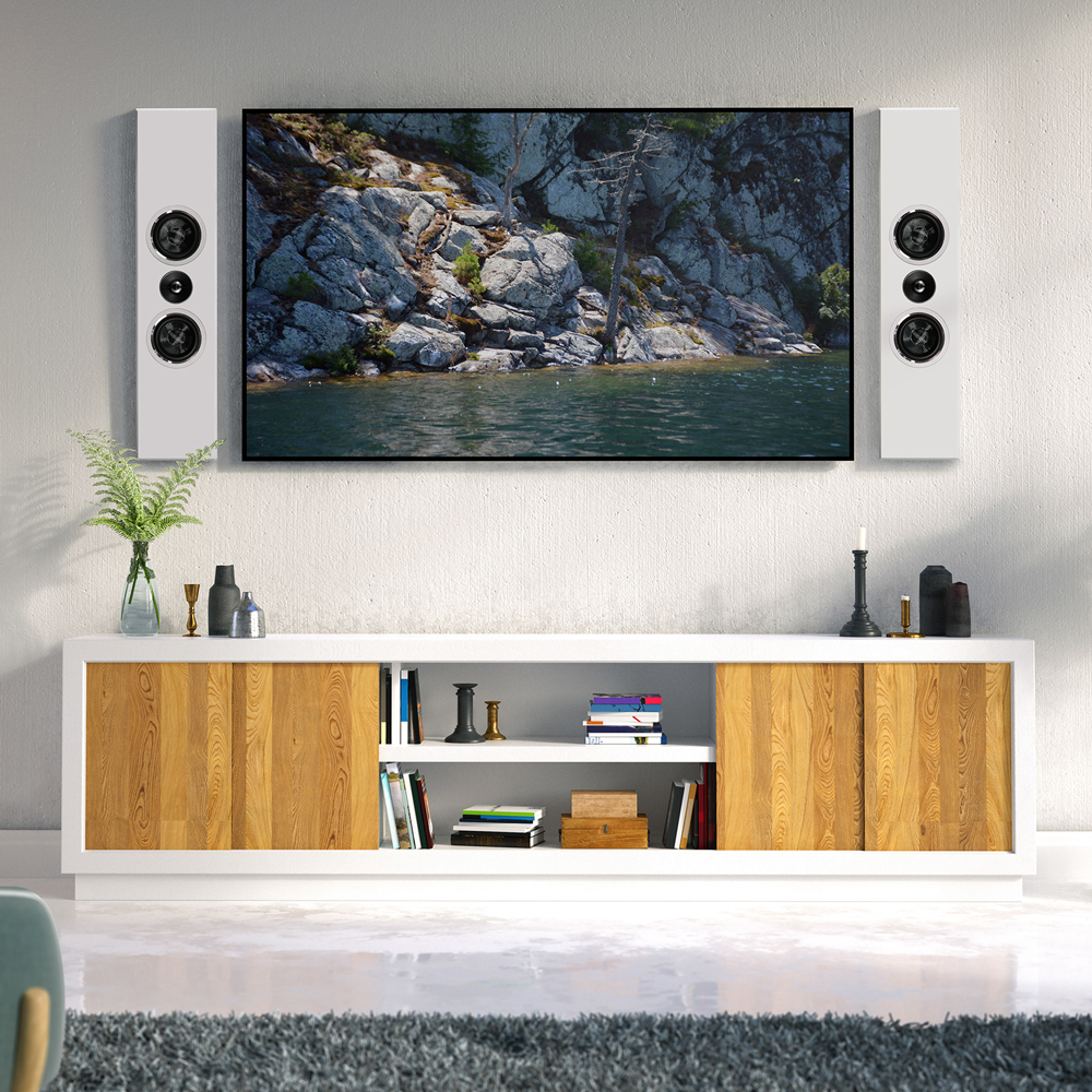 A pair of white PWM1 on-wall speakers flanking a TV