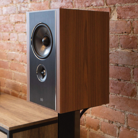 Synchrony B600 Satin Walnut on a stand.